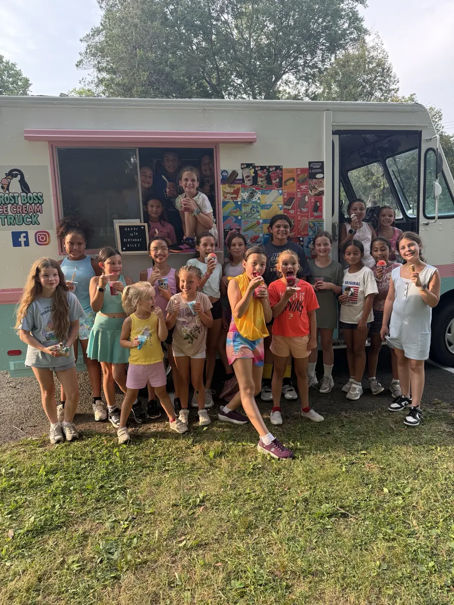 Children gathered in front of the Frost Boss Ice Cream Truck at a birthday party